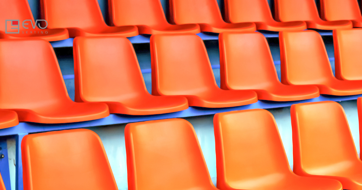 Workers producing heavy-duty and ergonomic stadium chairs