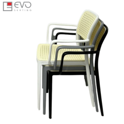 Plastic rattan chair with armrests